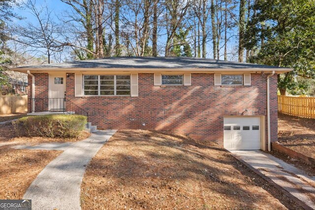 view of front of property with a garage