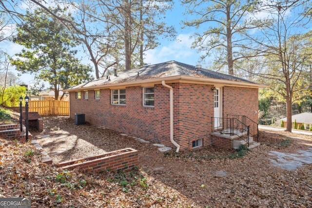 view of side of property with central AC