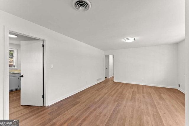 empty room with light wood-type flooring