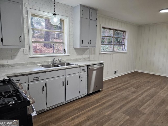 kitchen with pendant lighting, sink, gray cabinets, light wood-type flooring, and appliances with stainless steel finishes