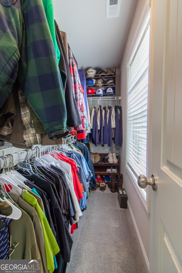 spacious closet featuring carpet floors