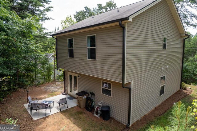 back of house with a patio