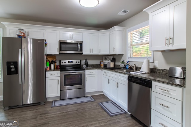 kitchen with white cabinets, sink, and stainless steel appliances