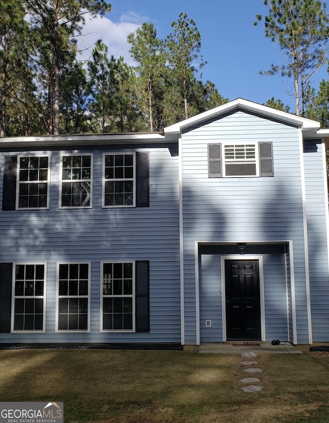 view of front of house with a front lawn