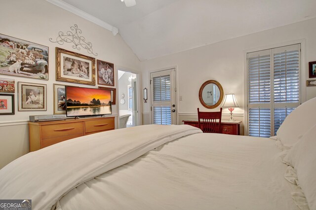 living area with hardwood / wood-style flooring, vaulted ceiling, and a notable chandelier