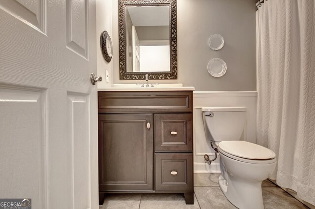 bathroom with tile patterned floors and toilet