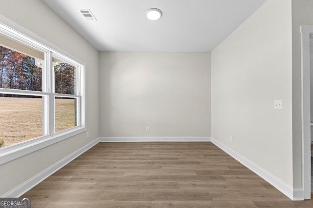 empty room featuring hardwood / wood-style floors