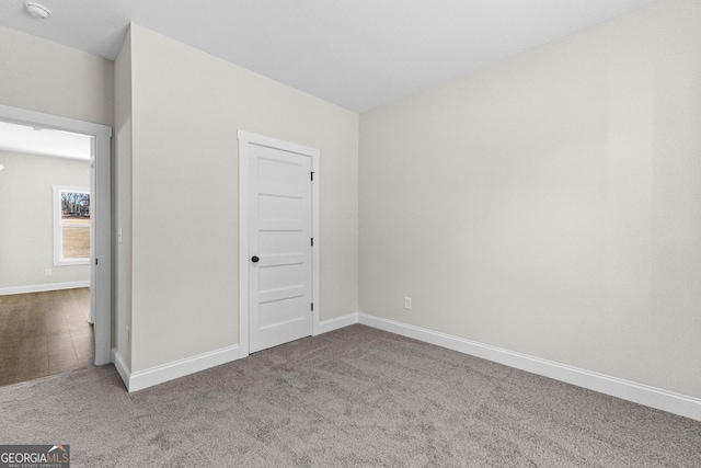 unfurnished room with carpet floors