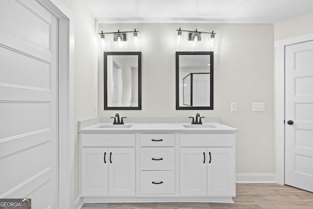 bathroom featuring vanity and wood-type flooring