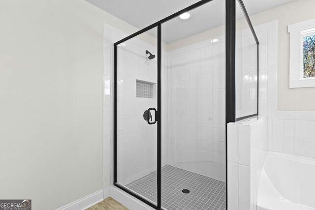 bathroom with independent shower and bath