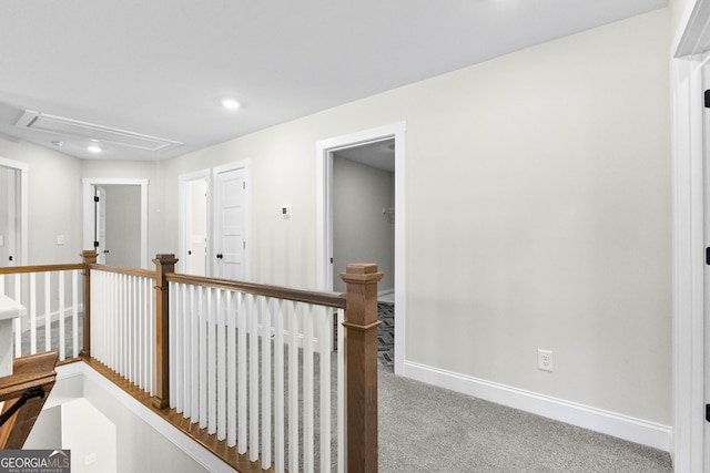 hallway with light carpet