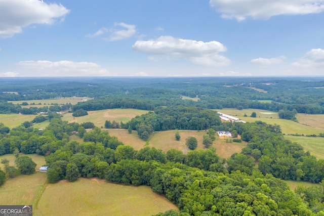 birds eye view of property with a rural view