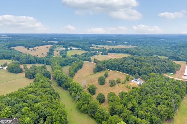 birds eye view of property with a rural view