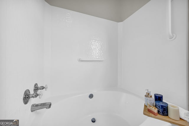 bathroom with a tub