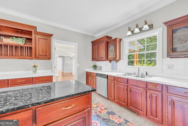 kitchen with stainless steel dishwasher, ornamental molding, sink, light tile patterned floors, and dark stone countertops