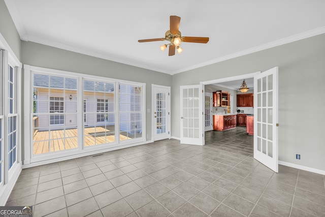 interior space with ceiling fan, ornamental molding, and french doors