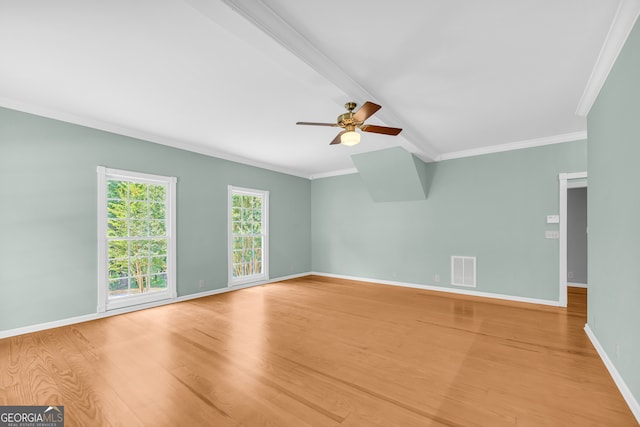 empty room with ceiling fan, beam ceiling, crown molding, and light hardwood / wood-style flooring