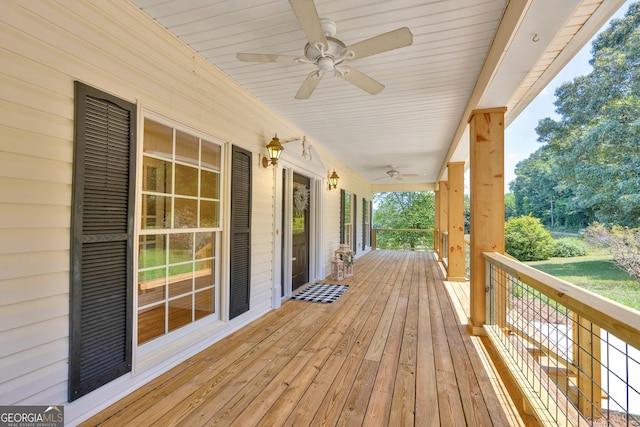 wooden deck featuring ceiling fan