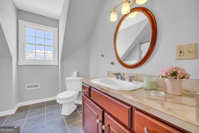 bathroom with tile patterned floors, vanity, and toilet