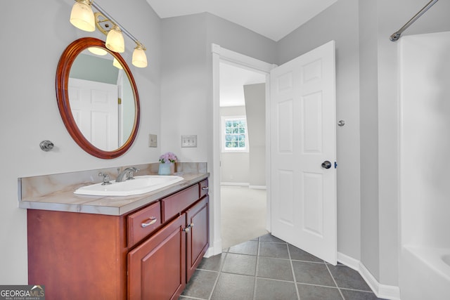 bathroom with tile patterned flooring and vanity