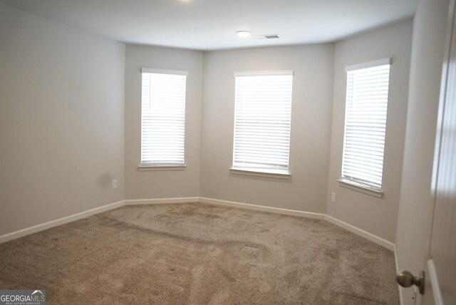 spare room with ceiling fan and dark hardwood / wood-style floors