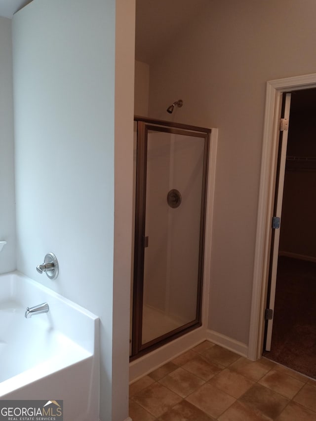 bathroom with shower with separate bathtub