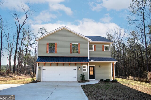 front of property featuring a garage