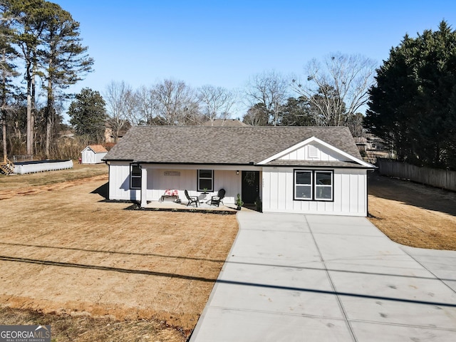 view of front of house with a patio and a front yard