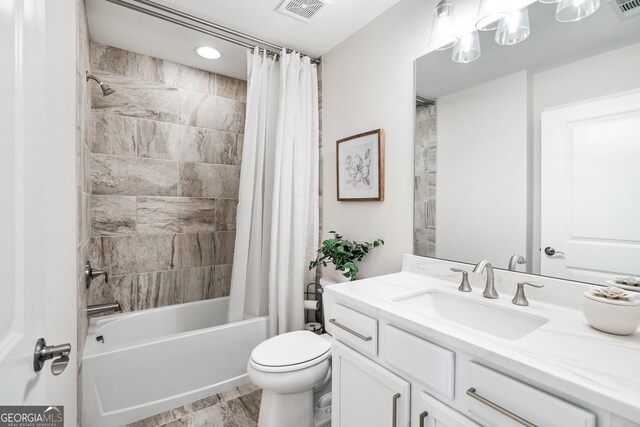 full bathroom with toilet, vanity, and shower / tub combo with curtain