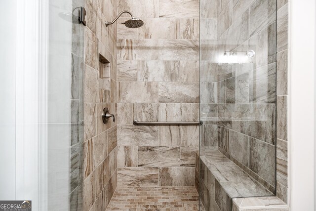 bathroom featuring tiled shower