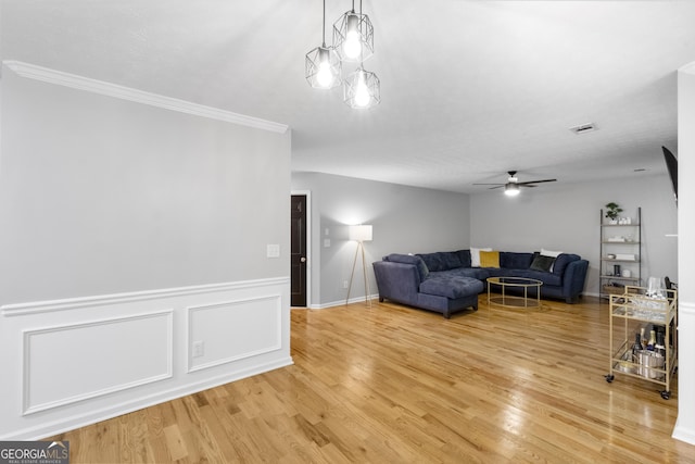 living room with ceiling fan and hardwood / wood-style floors