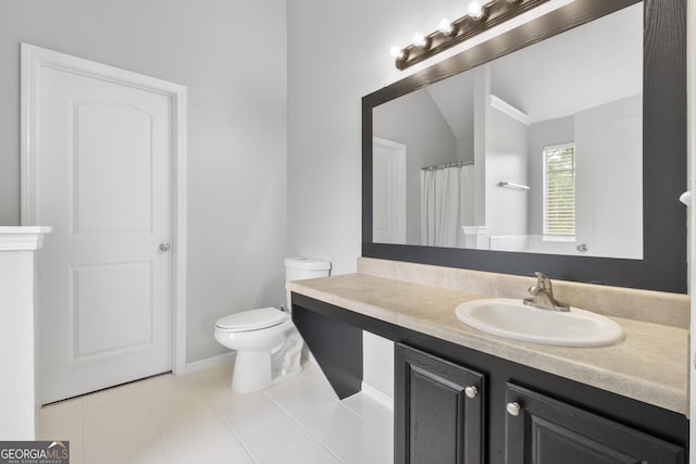 bathroom featuring vanity, vaulted ceiling, tile patterned flooring, toilet, and walk in shower