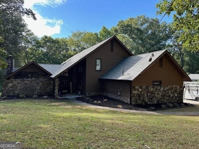 view of home's exterior with a lawn