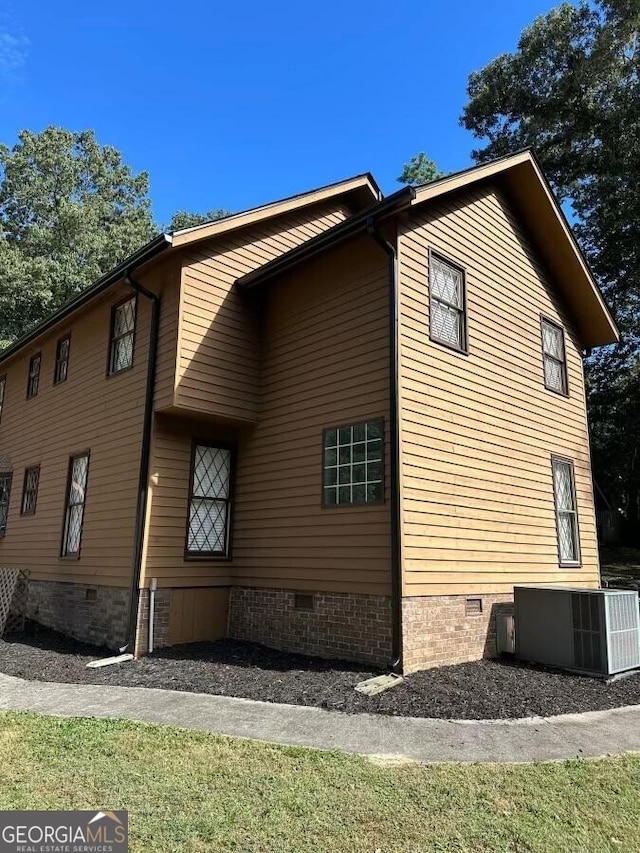 view of side of property featuring cooling unit