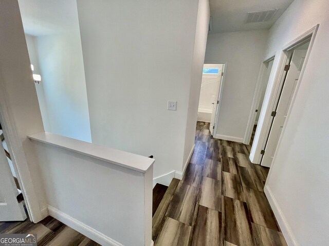 hallway featuring dark wood-type flooring