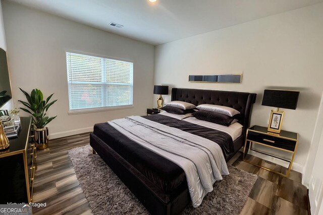 bedroom featuring dark hardwood / wood-style floors