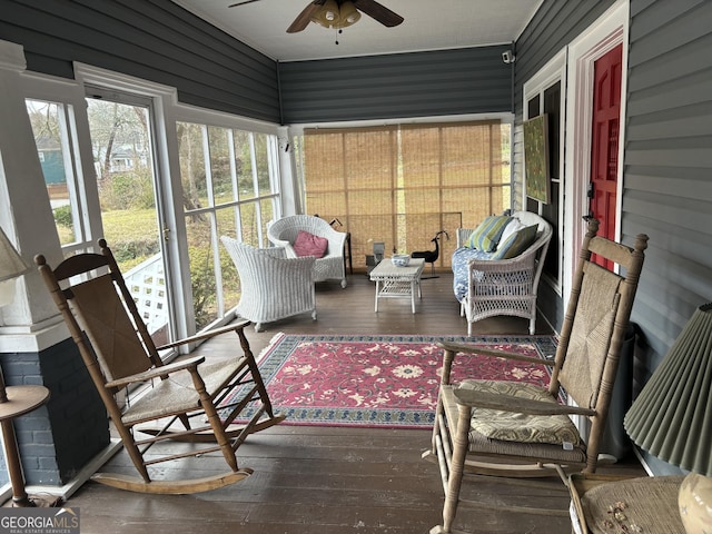 sunroom / solarium with ceiling fan