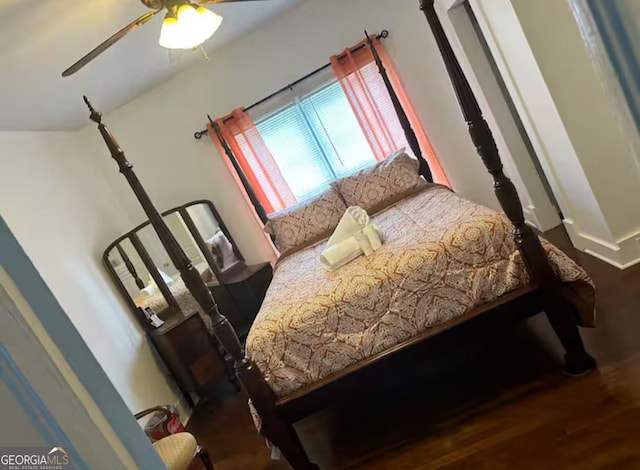 bedroom featuring ceiling fan and hardwood / wood-style flooring