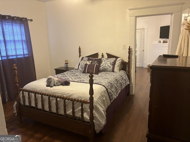 bedroom featuring dark hardwood / wood-style flooring