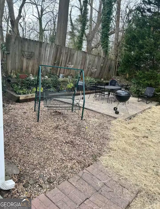 view of jungle gym with a patio area