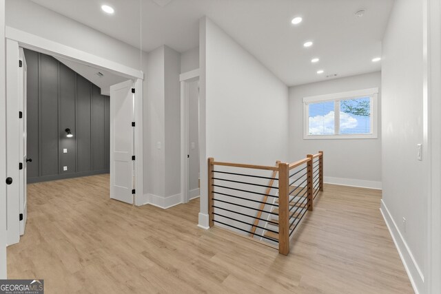 corridor with light hardwood / wood-style flooring