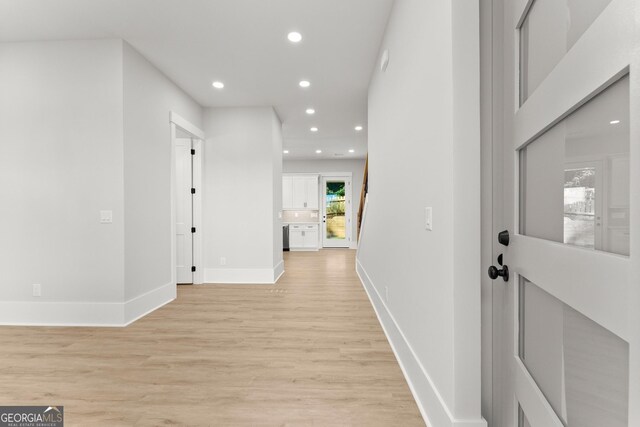 corridor featuring light hardwood / wood-style floors