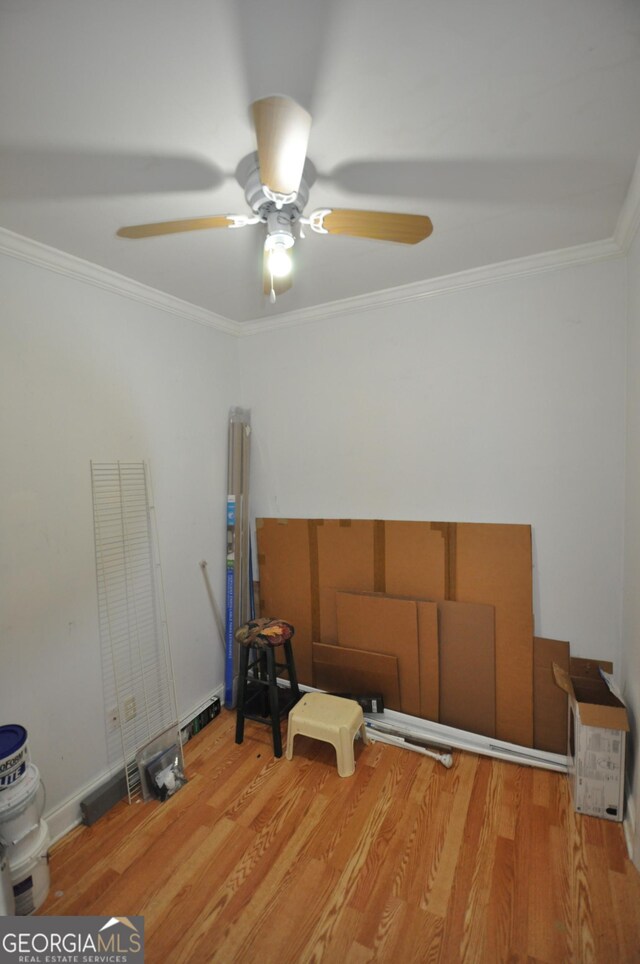 miscellaneous room featuring hardwood / wood-style flooring, ceiling fan, and crown molding