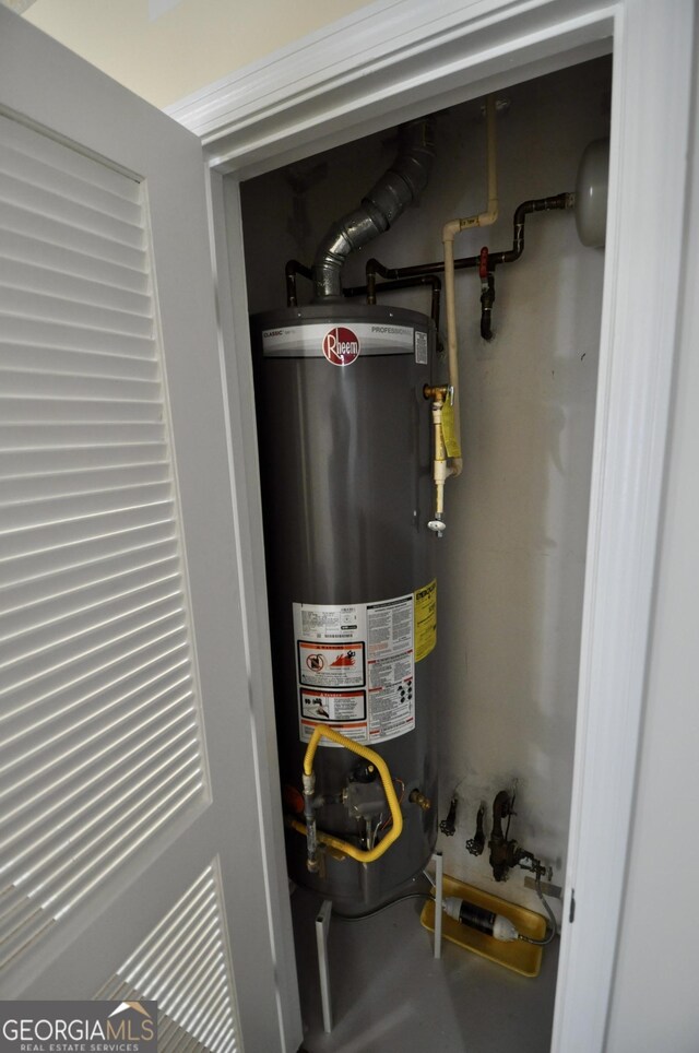 utility room with water heater