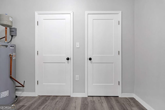 interior space featuring wood-type flooring and water heater