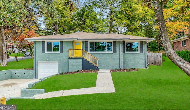 view of front of home featuring a garage and a front lawn