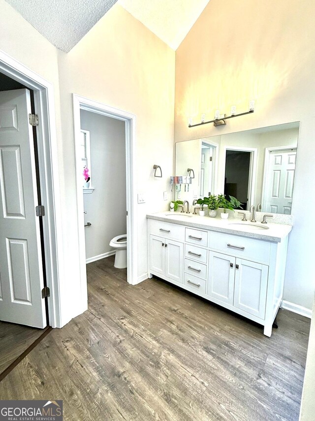 empty room featuring french doors, a drop ceiling, and dark hardwood / wood-style floors