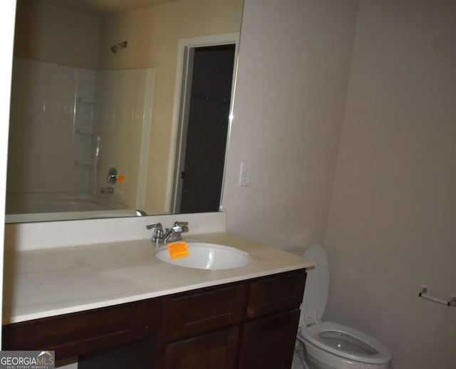 full bathroom featuring vanity, shower / bath combination, and toilet