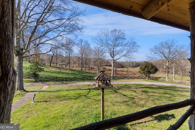 view of yard with a rural view