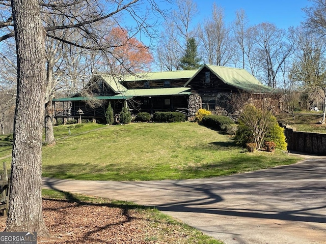 view of home's exterior with a lawn